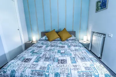 Letto o letti in una camera di Il Grattacielo b&b