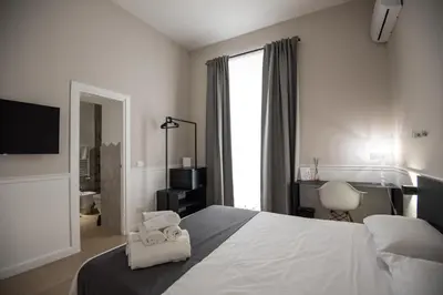 Letto o letti in una camera di Five Boutique Rooms