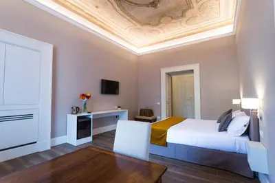 Letto o letti in una camera di Foro Carolino S&B