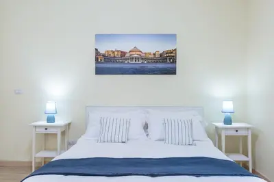 Letto o letti in una camera di A pochi passi da Piazza del Gesù by Wonderful Italy