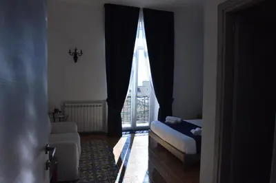 Letto o letti in una camera di Specchio di Parthenope B&B
