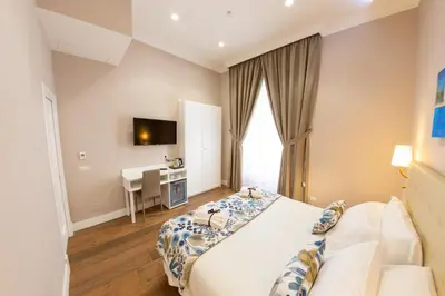 Letto o letti in una camera di Suite CuoreNapoletano