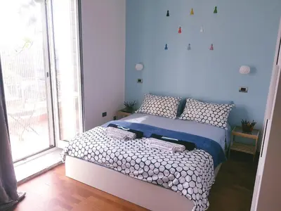 Letto o letti in una camera di B&B Musica e Mare