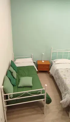 Letto o letti in una camera di Casa vacanze Napoli Centro Carmen & Sara