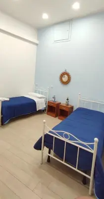 Letto o letti in una camera di Casa vacanze Napoli Centro Carmen & Sara