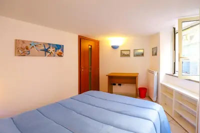 Letto o letti in una camera di La casa di Zucca sopra piazza Plebiscito!