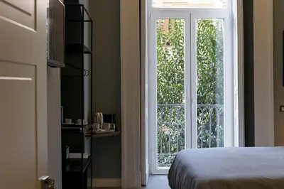 Letto o letti in una camera di Bellini Suite