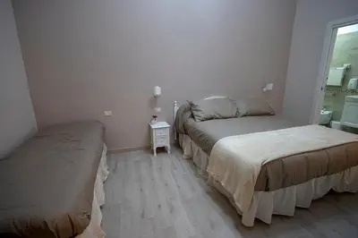 Letto o letti in una camera di Agorà Mura Greche B&b