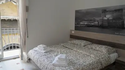 Letto o letti in una camera di Donna Vicenza Bed & Breakfast