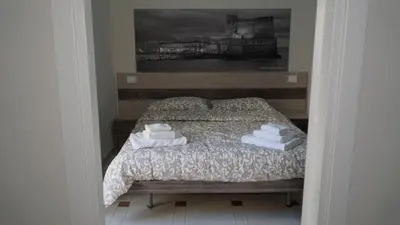 Letto o letti in una camera di Donna Vicenza Bed & Breakfast