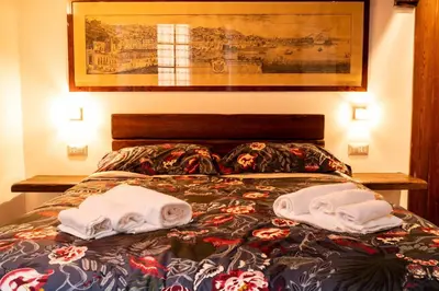 Letto o letti in una camera di Suite Piazza del Gesù By DomusExtra