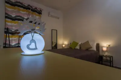 Letto o letti in una camera di Giù al Centro