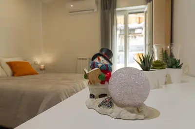 Letto o letti in una camera di Giù al Centro