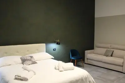 Letto o letti in una camera di Donna Lena Relais Napoli