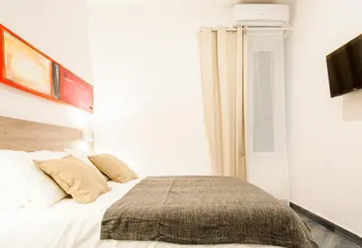 Letto o letti in una camera di Demi Rooms