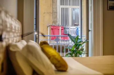 Letto o letti in una camera di MelRose Napoli