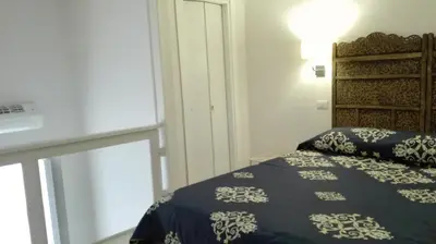 Letto o letti in una camera di Piano Nobile by Napoliapartments