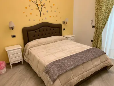Letto o letti in una camera di B&B Le Stanze di Santa Chiara