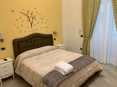 Letto o letti in una camera di B&B Le Stanze di Santa Chiara