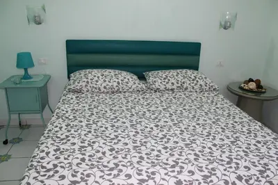 Letto o letti in una camera di Viaggio a Napoli B&B