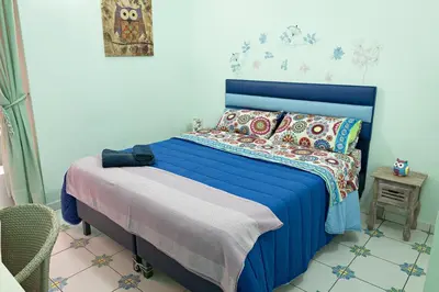Letto o letti in una camera di Viaggio a Napoli B&B