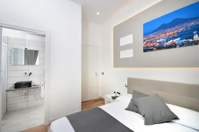 Letto o letti in una camera di B&BCentral Station Napoli