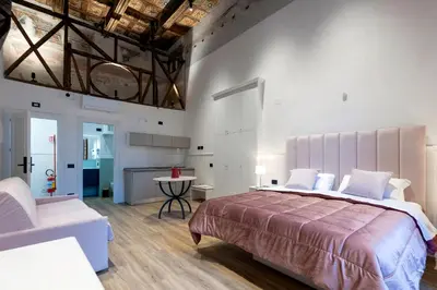 Letto o letti in una camera di Il Tesoro Smart Suite & SPA