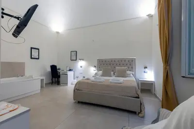 Letto o letti in una camera di Il Tesoro Smart Suite & SPA