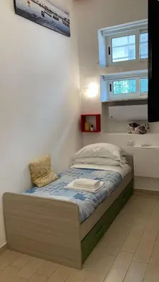 Letto o letti in una camera di Ginevra’s Apartment