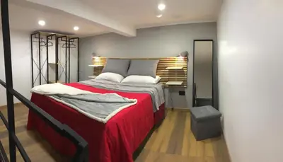 Letto o letti in una camera di JordanAus Napoli Centro