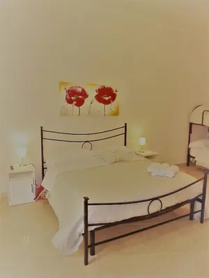 Letto o letti in una camera di Domusrealstella