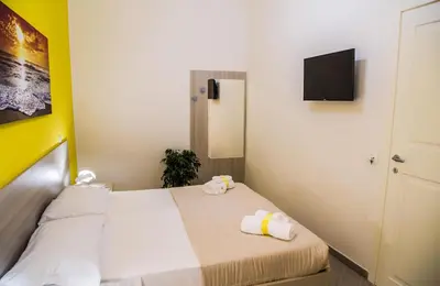 Letto o letti in una camera di Borgo Angioino