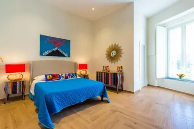 Letto o letti in una camera di La Gatta Cenerentola Rooms