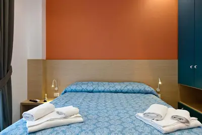 Letto o letti in una camera di Domus Schilizzi