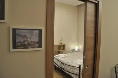 Letto o letti in una camera di Alexis Home