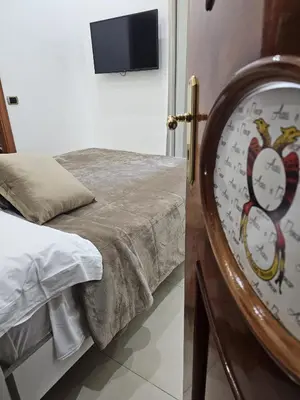 Letto o letti in una camera di B&B TERRONIA