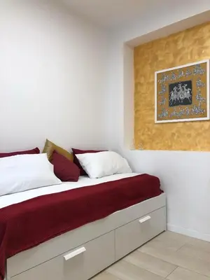 Letto o letti in una camera di FV STUDIOS Riviera