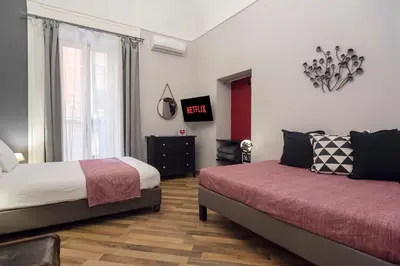 Letto o letti in una camera di Tredici Boutique Rooms