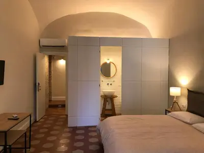 Letto o letti in una camera di Palazzo Pignatelli