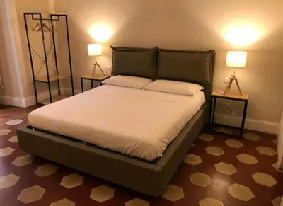 Letto o letti in una camera di Palazzo Pignatelli