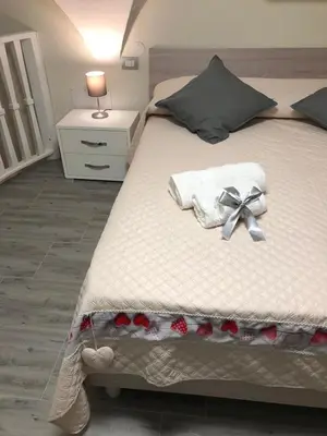 Letto o letti in una camera di LA CASA DI NANA'