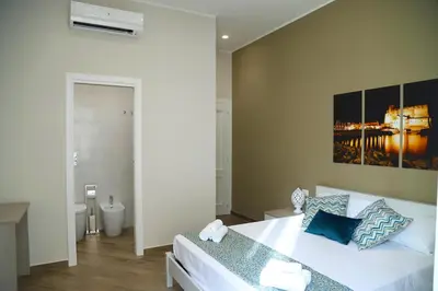 Letto o letti in una camera di Domus Cordis Napoli