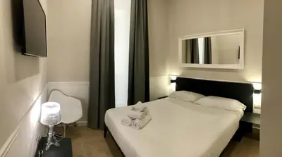 Letto o letti in una camera di KUKKA ROOMS