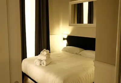 Letto o letti in una camera di KUKKA ROOMS