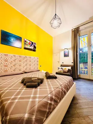 Letto o letti in una camera di B&B Cosmoneapolitan