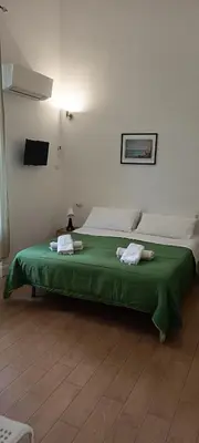 Letto o letti in una camera di Casa Laura Oliva Mancini