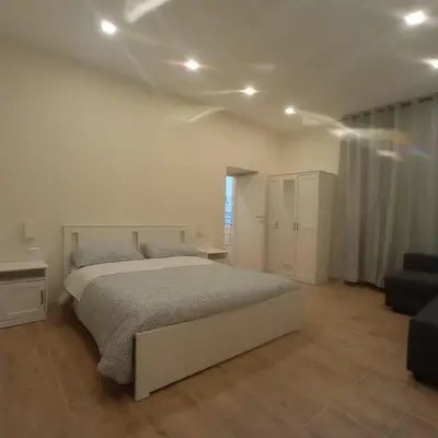 Letto o letti in una camera di DUOMO APARTAMENT'S