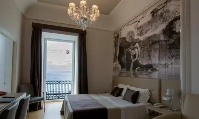 Letto o letti in una camera di Partenope Relais
