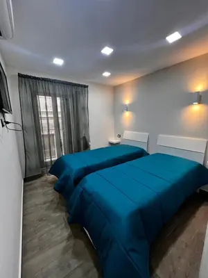 Letto o letti in una camera di B&B Zia Giuseppina & Rosa alla Riviera di Chiaia