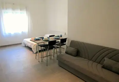 Area soggiorno di Maison Ninì - Vicino Metro e Lungomare - Relax a Napoli